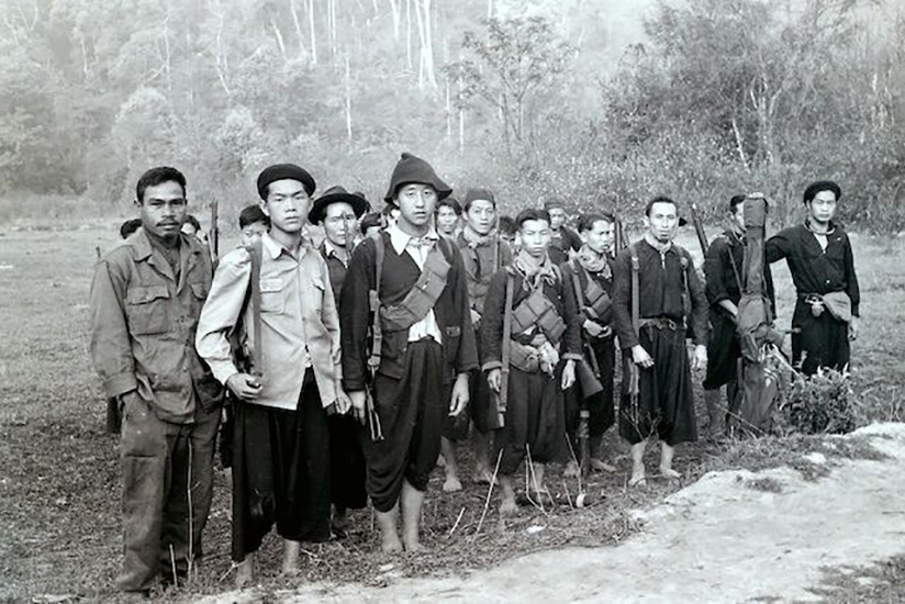 Hmong soldiers enlisted by the US during the Vietnam Conflict pause to have their photo taken.